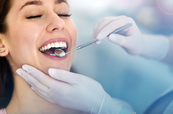 Woman getting a dental exam, at Myers Park Dental Partners in Charlotte, NC.